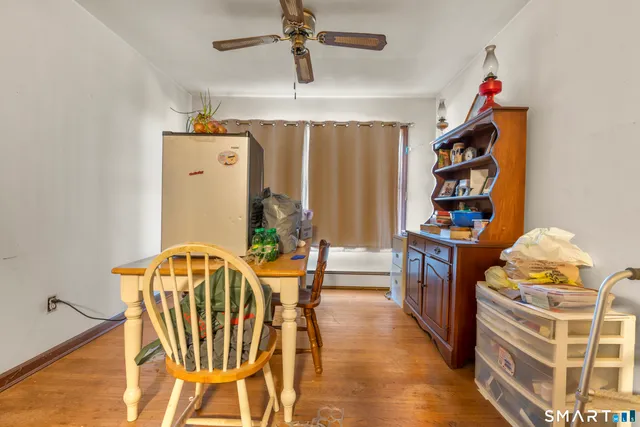 a dining room with furniture and chandelier