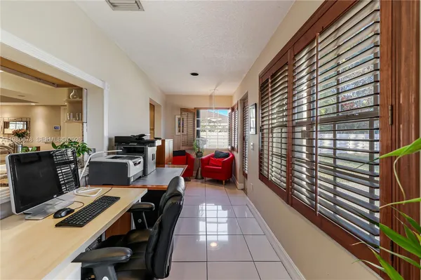 a kitchen with stainless steel appliances granite countertop a refrigerator and a stove