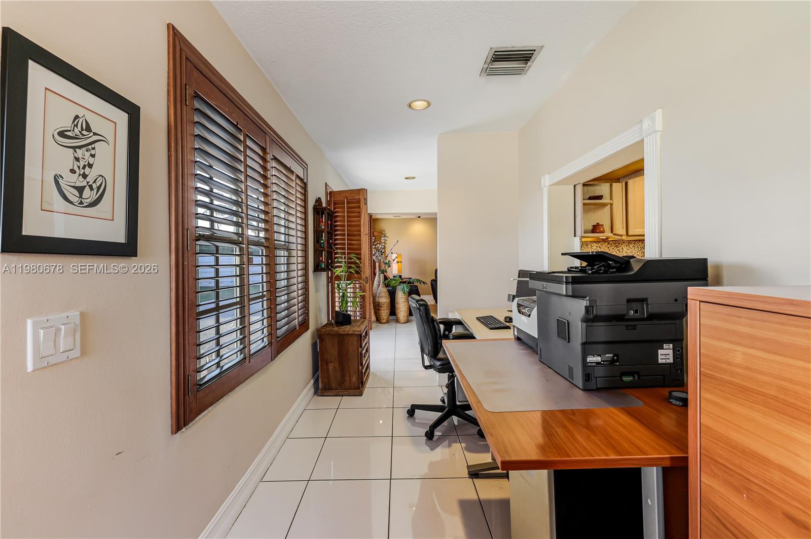 14952 Southwest 149th Street Miami, FL 33196 - Photo 15 of 64 a view of a workspace with furniture and toys