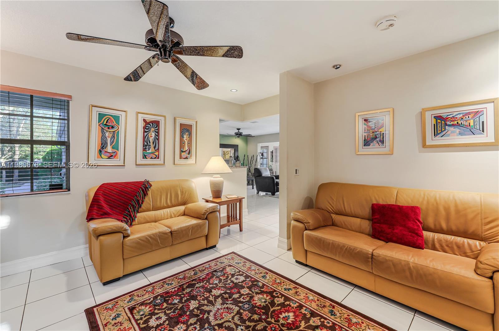 14952 Southwest 149th Street Miami, FL 33196 - Photo 17 of 64 a living room with furniture and a rug