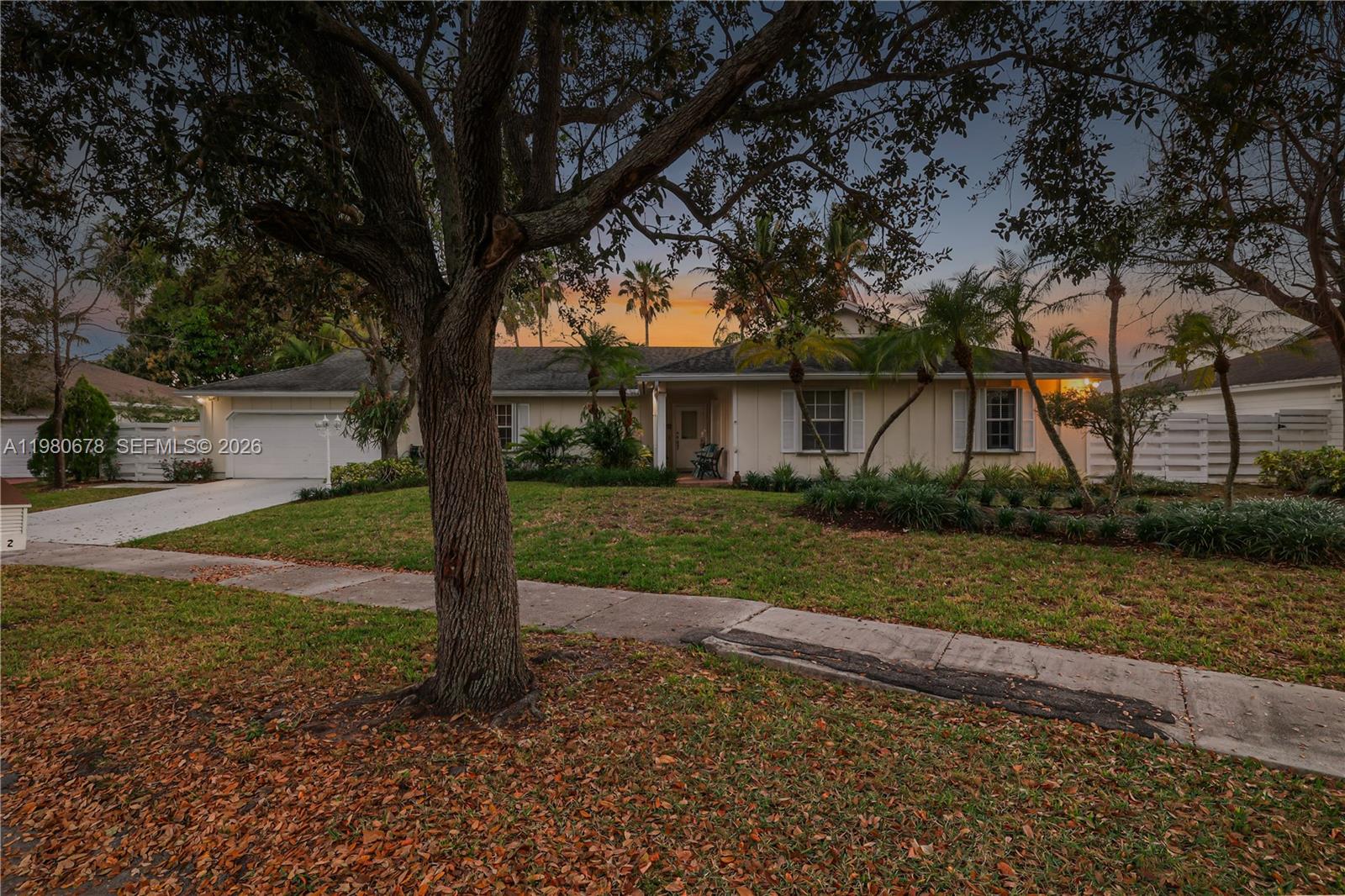 14952 Southwest 149th Street Miami, FL 33196 - Photo 2 of 64 a front view of a house with garden