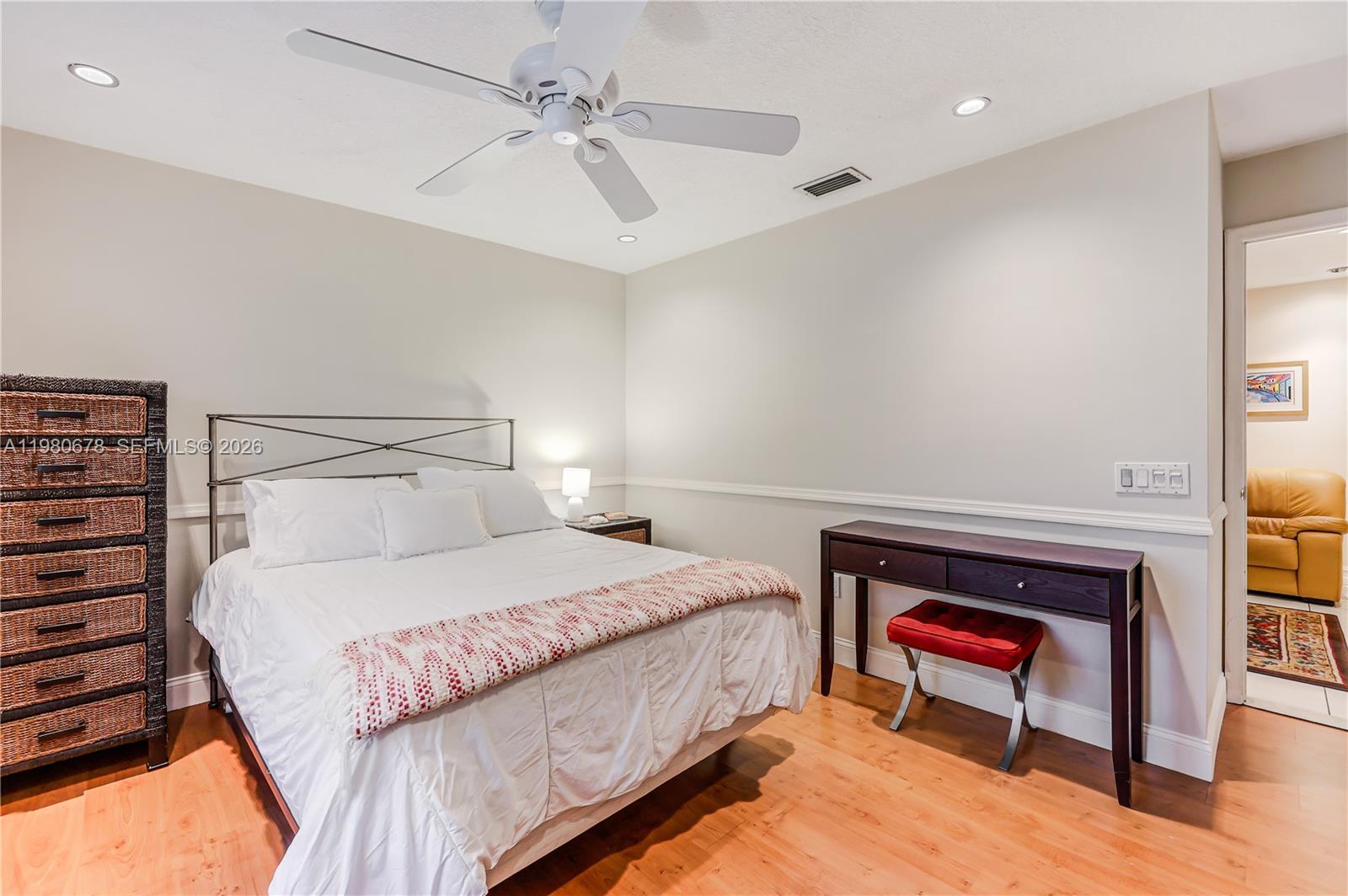 14952 Southwest 149th Street Miami, FL 33196 - Photo 33 of 64 a bedroom with a bed and a chandelier