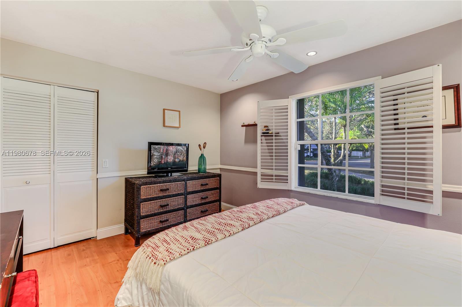 14952 Southwest 149th Street Miami, FL 33196 - Photo 34 of 64 a bedroom with a bed and a window