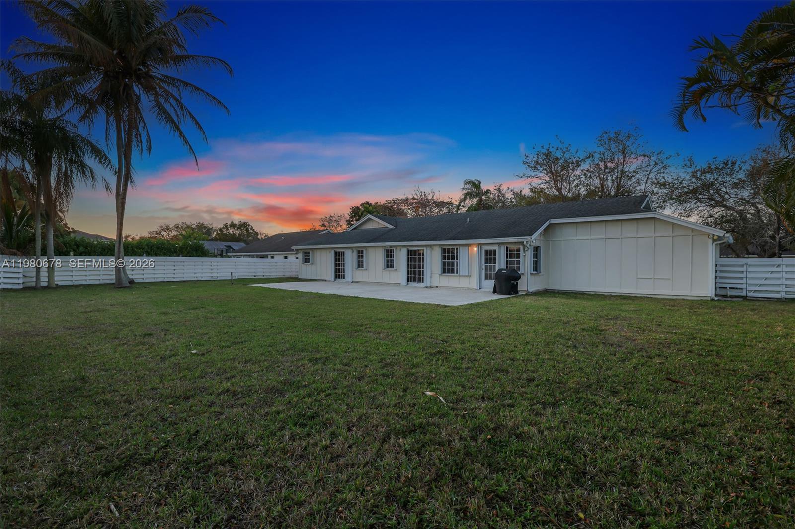14952 Southwest 149th Street Miami, FL 33196 - Photo 40 of 64 a view of a house with a backyard