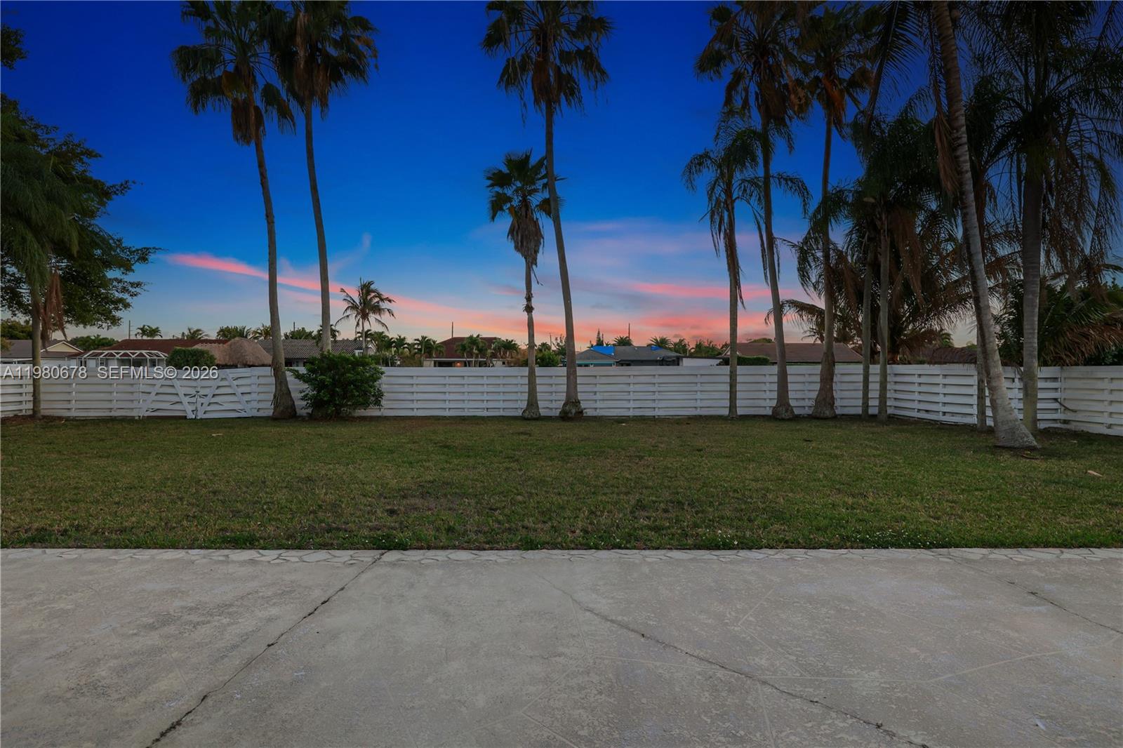 14952 Southwest 149th Street Miami, FL 33196 - Photo 45 of 64 a view of a garden with a palm tree