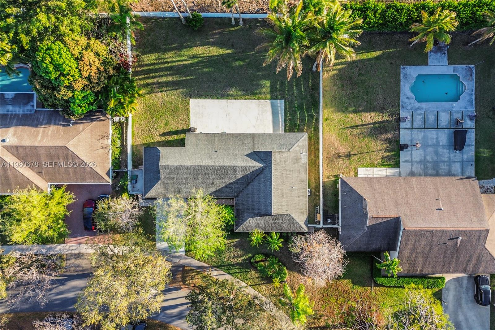 14952 Southwest 149th Street Miami, FL 33196 - Photo 47 of 64 a aerial view of a house with a yard and potted plants