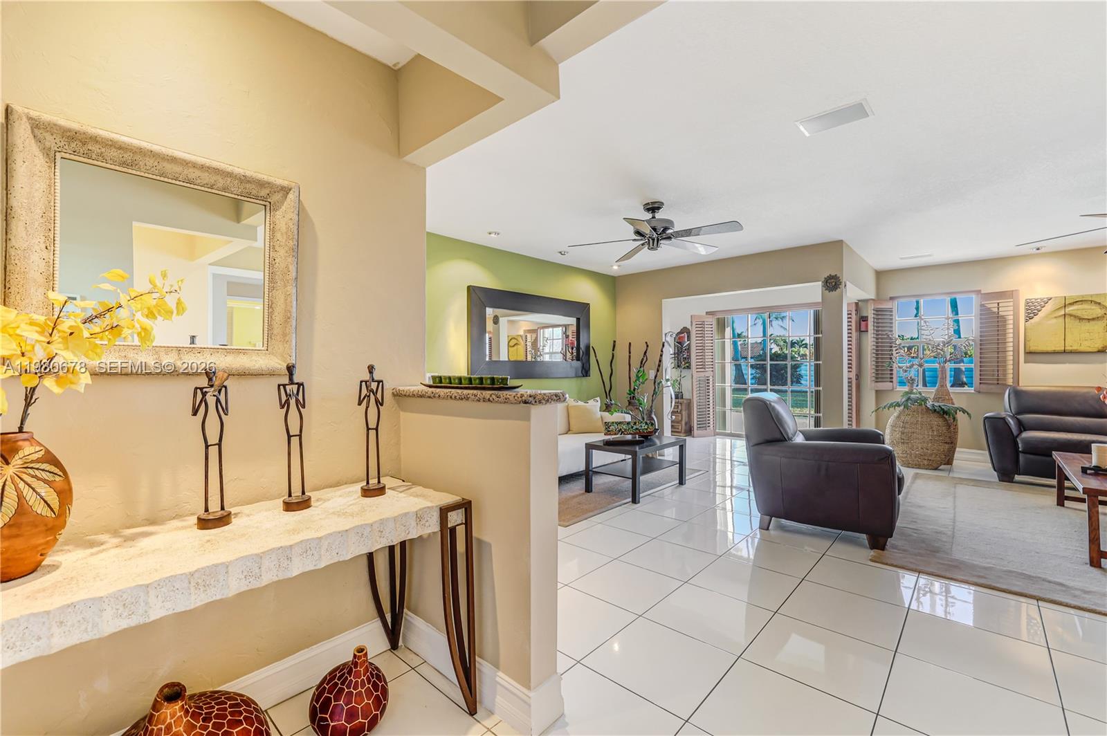14952 Southwest 149th Street Miami, FL 33196 - Photo 7 of 64 a living room with furniture and a flat screen tv
