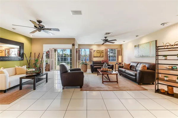 a living room with fireplace furniture and a flat screen tv