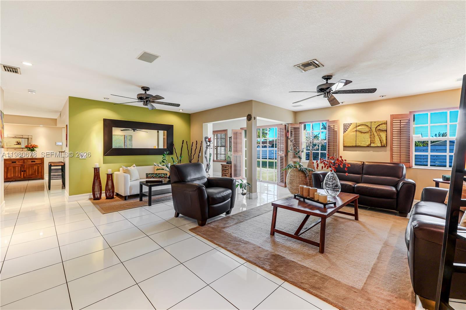 14952 Southwest 149th Street Miami, FL 33196 - Photo 10 of 64 a living room with fireplace furniture and a flat screen tv