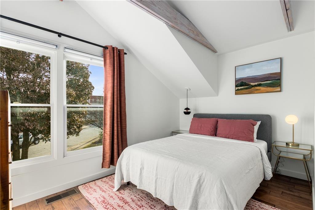 69 Randolph Street Northeast, Unit B Atlanta, GA 30312 - Photo 13 of 19 a bedroom with a large bed and a window