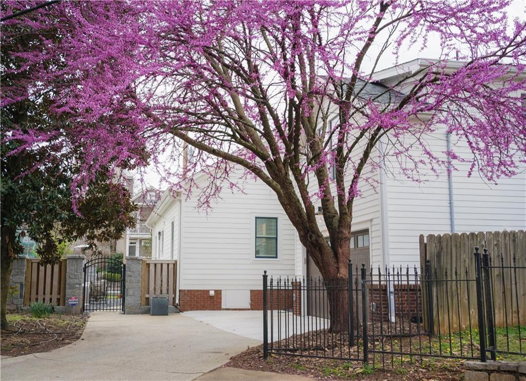 69 Randolph Street Northeast, Unit B Atlanta, GA 30312 - Photo 15 of 19 a tree is standing in between the two tall trees