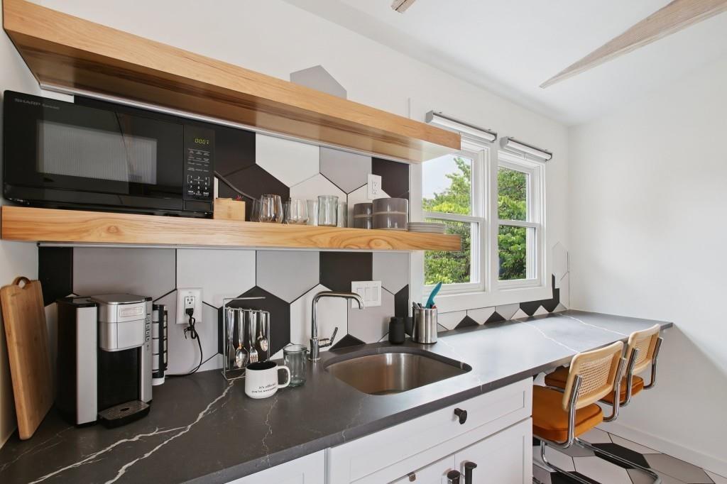 69 Randolph Street Northeast, Unit B Atlanta, GA 30312 - Photo 5 of 19 a kitchen with a sink and a microwave