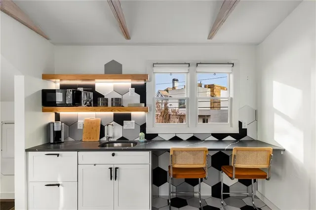 a kitchen with a sink and a stove