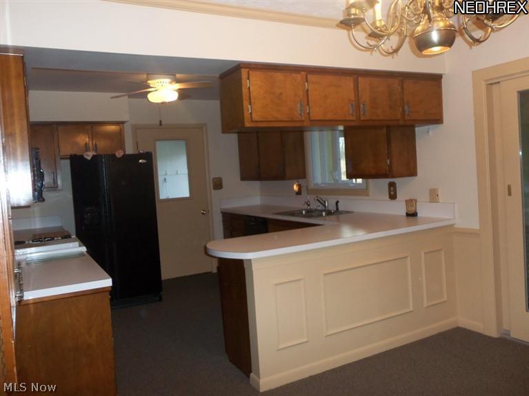 15640 Georgia Road Middlefield, OH 44062 - Photo 2 of 19 Roomy kitchen with all the appliances and plenty of counter space. Door leading to rear entry/mud room.