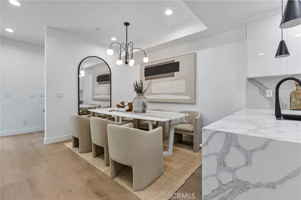 a view of a kitchen area with furniture and chandelier