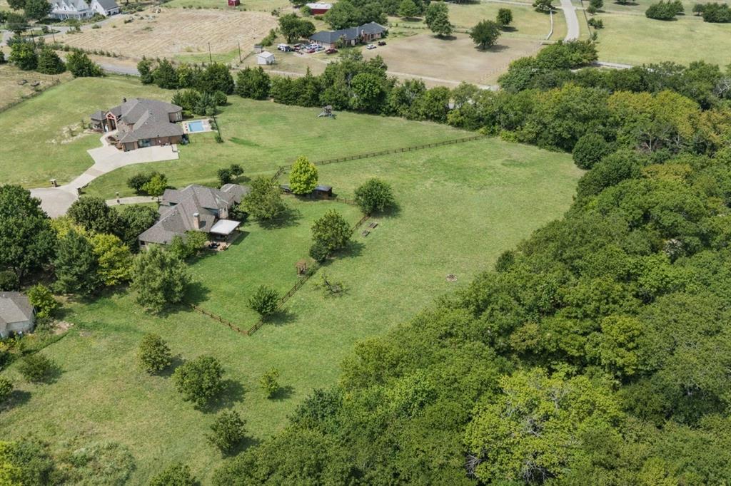 1520 Snider Court Lucas, TX 75002 - Photo 39 of 40 This amazing property sits on a quiet cul-de-sac with over 3 acres and is surrounded by lush green trees and natural landscaping that offers serenity and seclusion and is just minutes from Trinity Trail and Lake Lavon and is close to upscale shopping and dining.