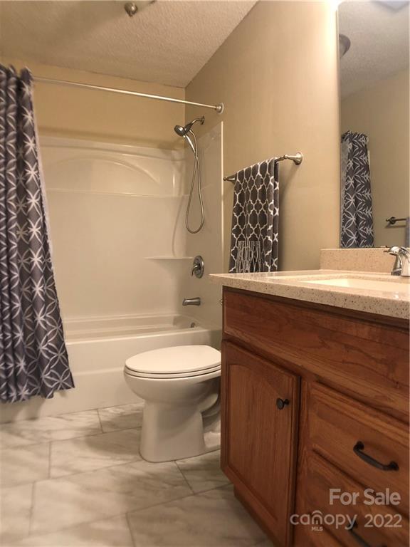 790 South Main Street Rutherfordton, NC 28139 - Photo 11 of 21 a bathroom with a sink a toilet and shower