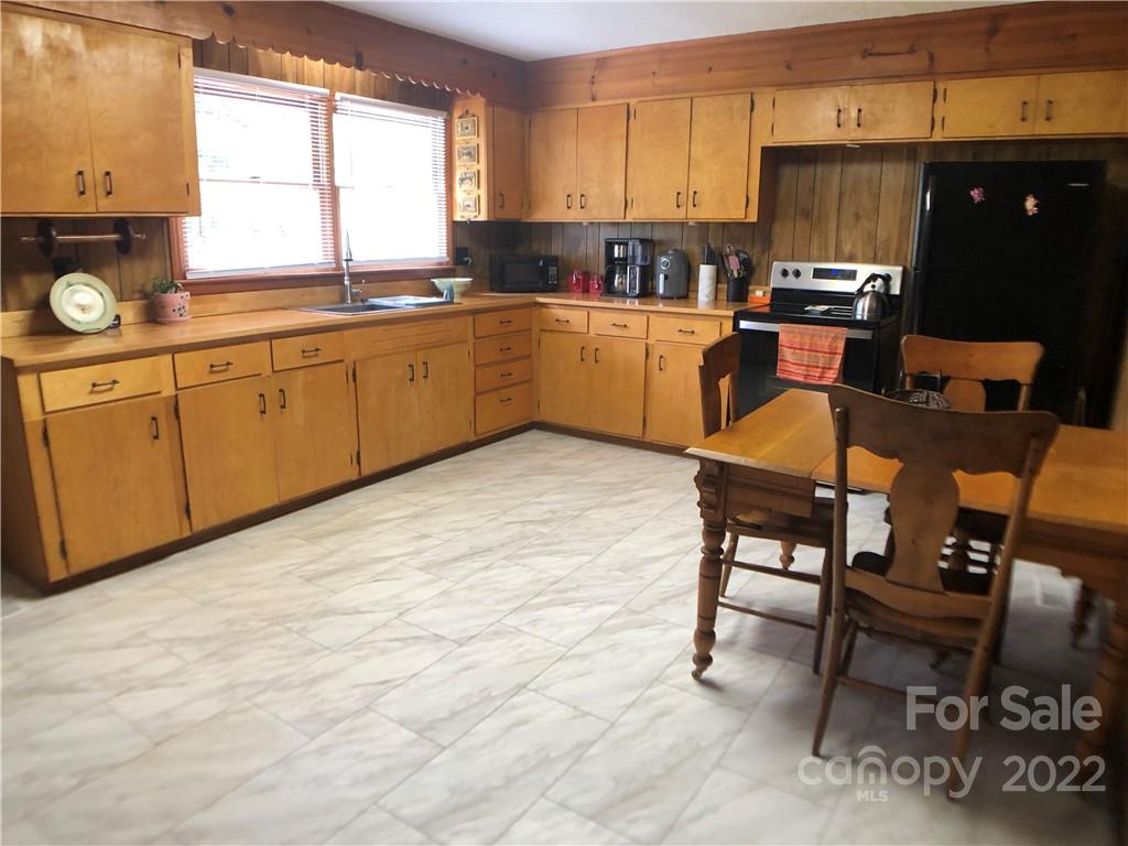 790 South Main Street Rutherfordton, NC 28139 - Photo 6 of 21 a room with stainless steel appliances kitchen island granite countertop a sink and cabinets