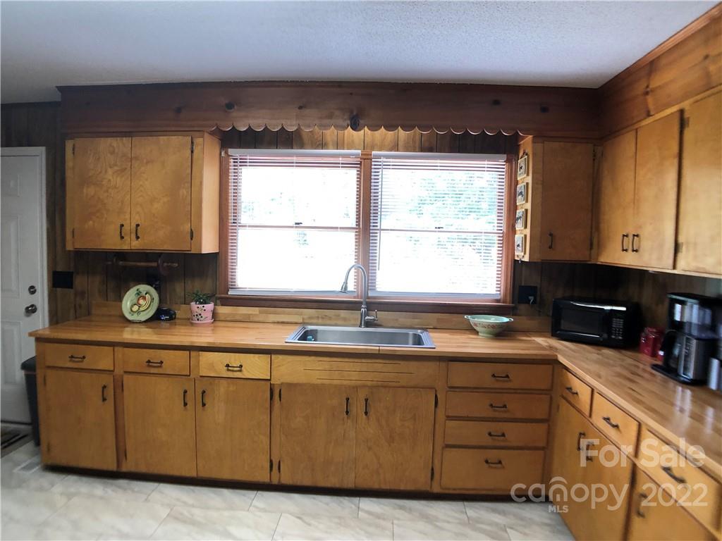 790 South Main Street Rutherfordton, NC 28139 - Photo 9 of 21 a kitchen with cabinets a window and appliances