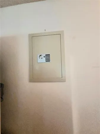 a bedroom with a bed and a lamp
