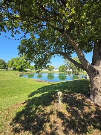 a view of a lake with a yard