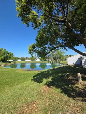a view of a lake with a yard