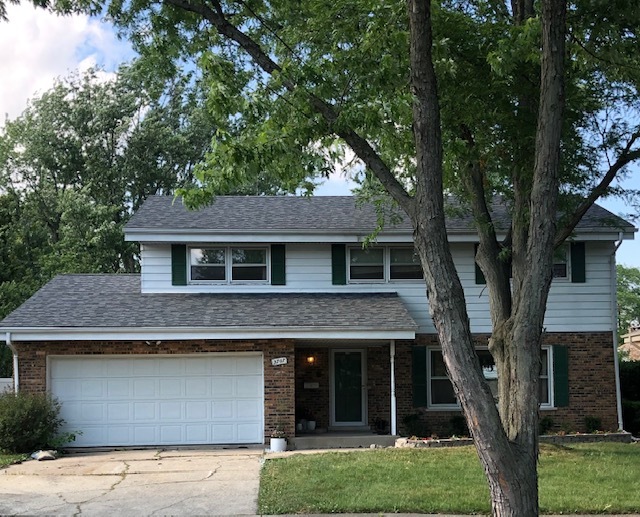 3707 Poplar Road Flossmoor, IL 60422 - Photo 1 of 10 a front view of a house with a garden