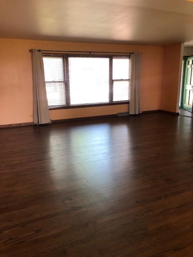 3707 Poplar Road Flossmoor, IL 60422 - Photo 2 of 10 an empty room with wooden floor and windows