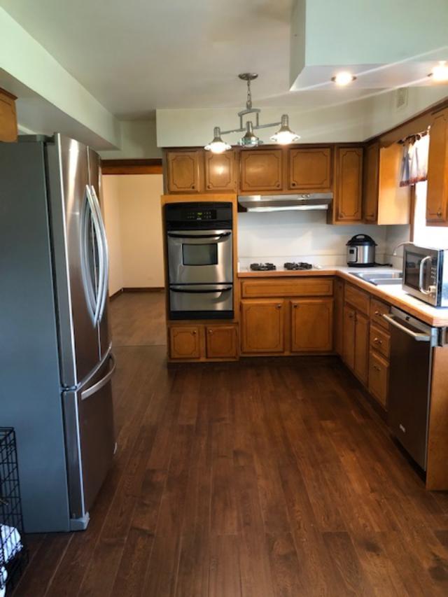 3707 Poplar Road Flossmoor, IL 60422 - Photo 5 of 10 a kitchen with stainless steel appliances granite countertop a refrigerator a sink dishwasher a stove with wooden floor and cabinets