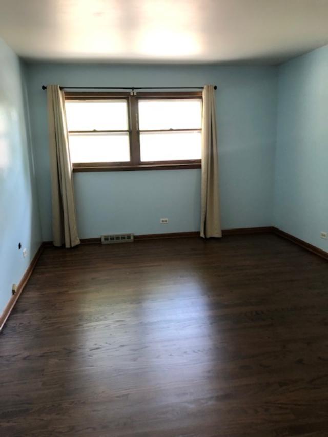 3707 Poplar Road Flossmoor, IL 60422 - Photo 7 of 10 an empty room with wooden floor and windows