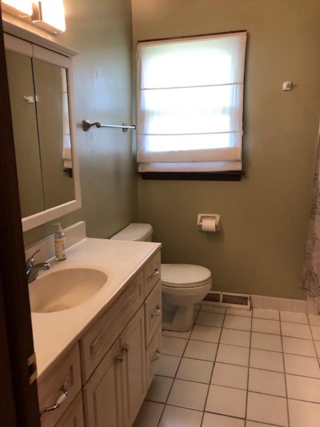 3707 Poplar Road Flossmoor, IL 60422 - Photo 8 of 10 a bathroom with a granite countertop toilet sink and mirror