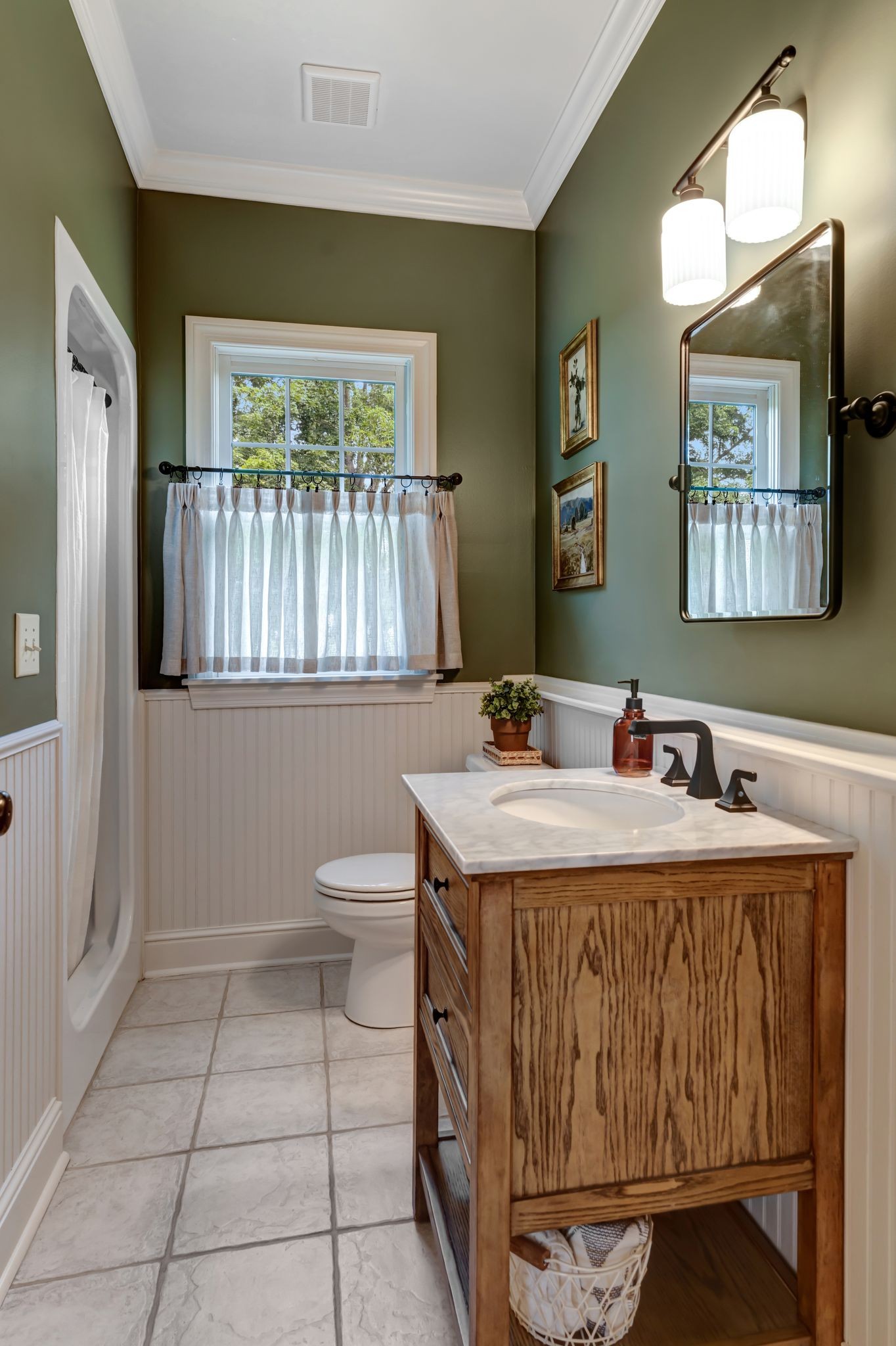 1605 Big Springs Road Lebanon, TN 37087 - Photo 21 of 65 a bathroom with a sink a toilet and mirror