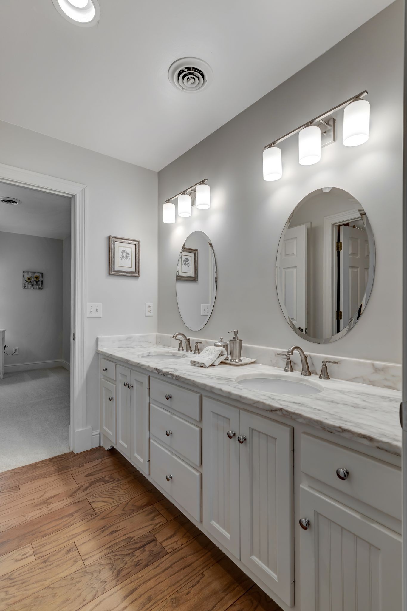 1605 Big Springs Road Lebanon, TN 37087 - Photo 32 of 65 a bathroom with double vanity sinks and a mirror