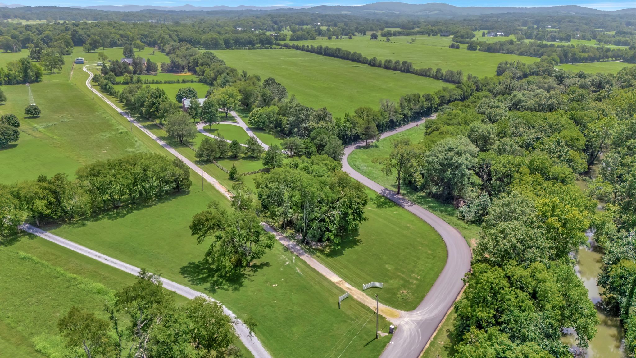 1605 Big Springs Road Lebanon, TN 37087 - Photo 55 of 65 an aerial view of green landscape with trees houses and large trees