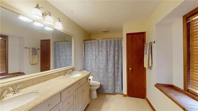 a view of balcony with furniture and wooden floor