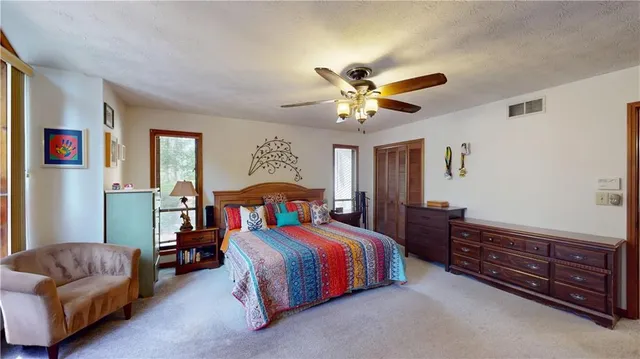 a view of a house with a porch and furniture