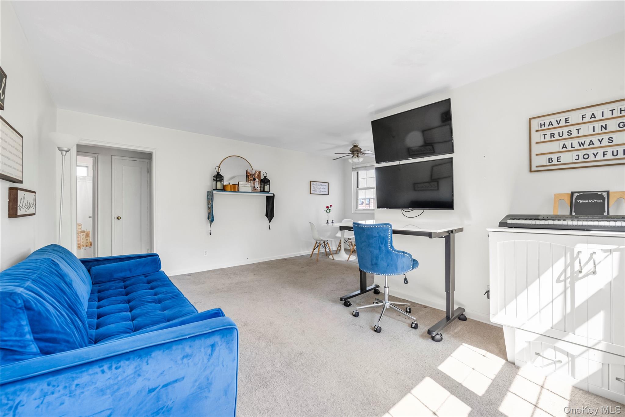 211-11 73rd Avenue, Unit B Queens, NY 11364 - Photo 2 of 11 a living room with furniture and a flat screen tv
