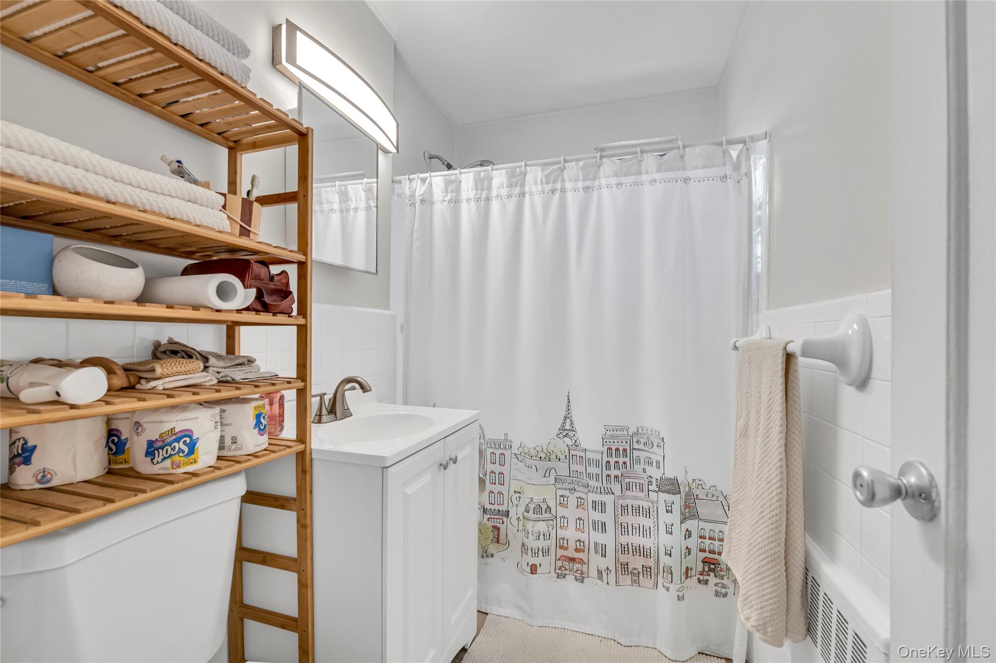 211-11 73rd Avenue, Unit B Queens, NY 11364 - Photo 9 of 11 a bathroom with a sink toilet and shower