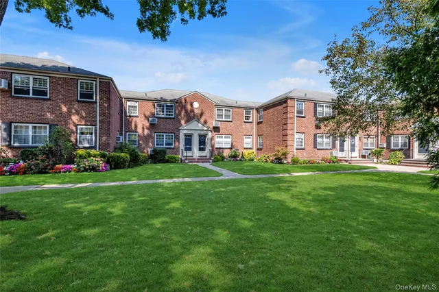 a front view of a building with garden