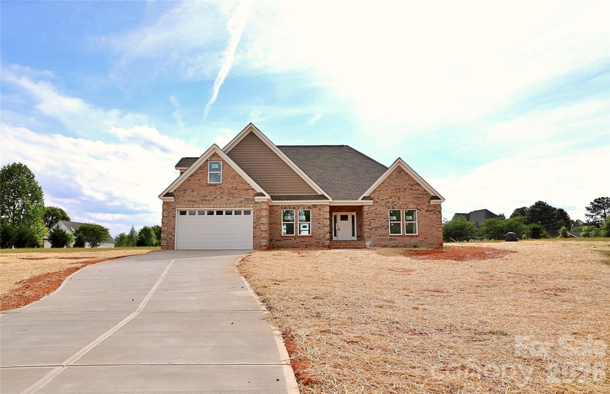 5646 Zion Church Road Concord, NC 28025 - Photo 8 of 8 a front view of a house with a yard and garage