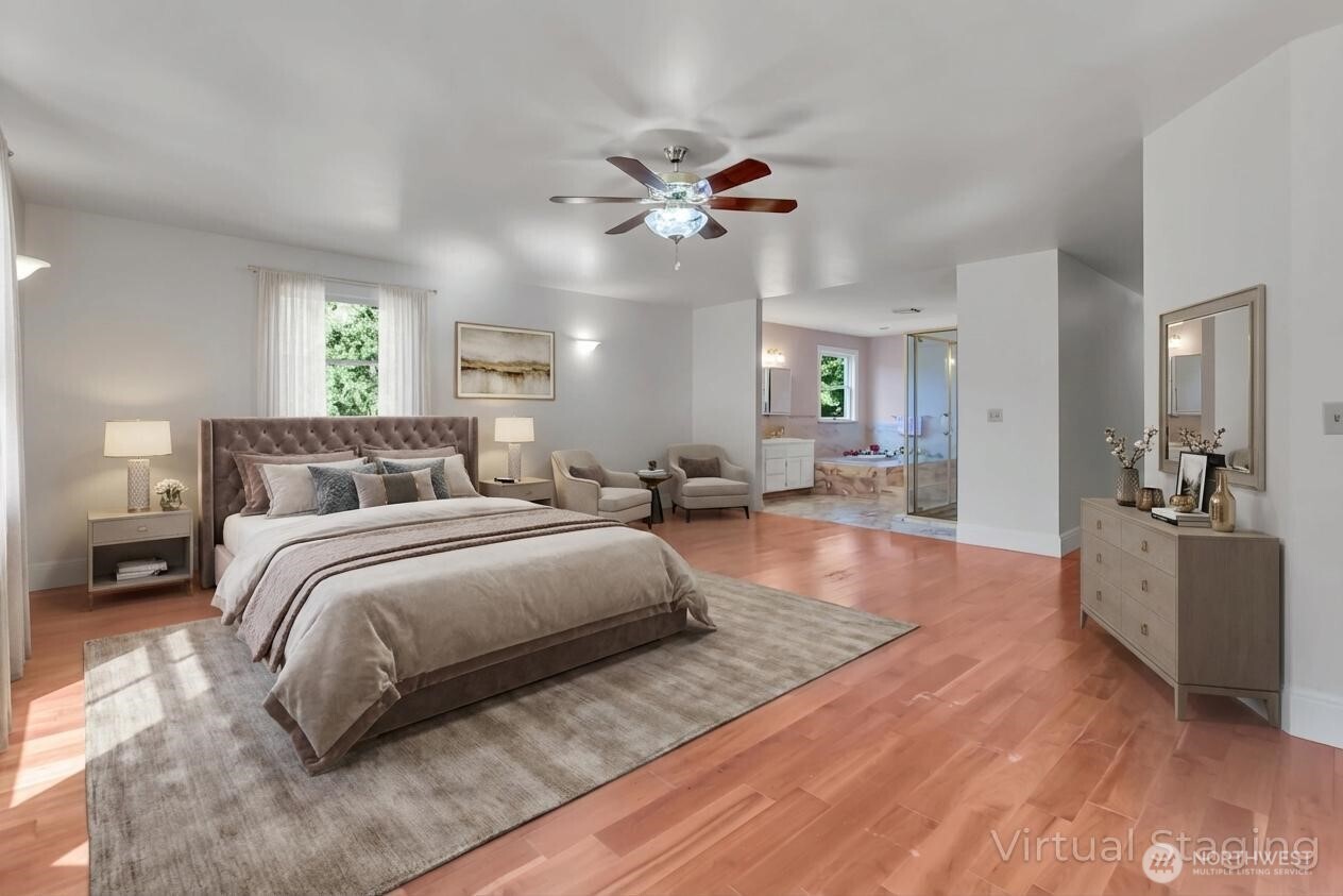1622 Southwest 140th Street Burien, WA 98166 - Photo 12 of 38 a spacious bedroom with a large bed and a chandelier