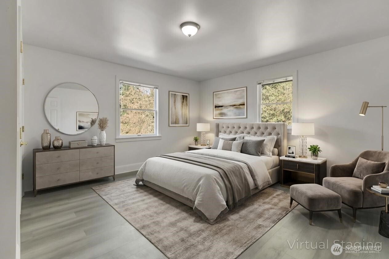 1622 Southwest 140th Street Burien, WA 98166 - Photo 16 of 38 a bedroom with a bed a mirror and a window