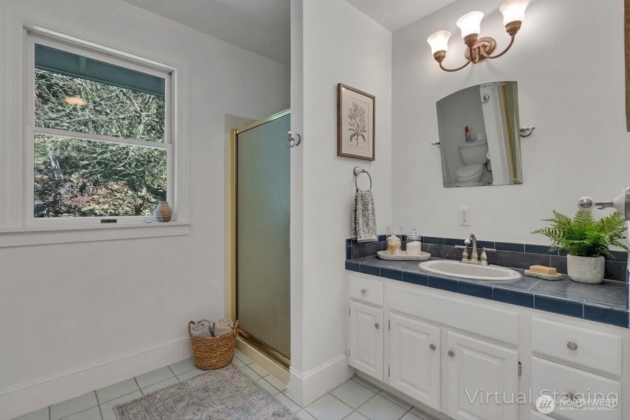 1622 Southwest 140th Street Burien, WA 98166 - Photo 18 of 38 a bathroom with a sink and a mirror