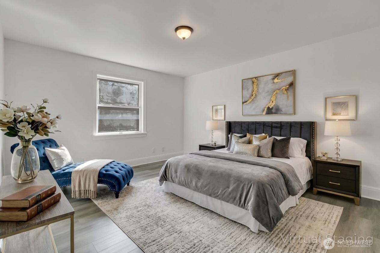 1622 Southwest 140th Street Burien, WA 98166 - Photo 19 of 38 a bedroom with a bed and wooden floor