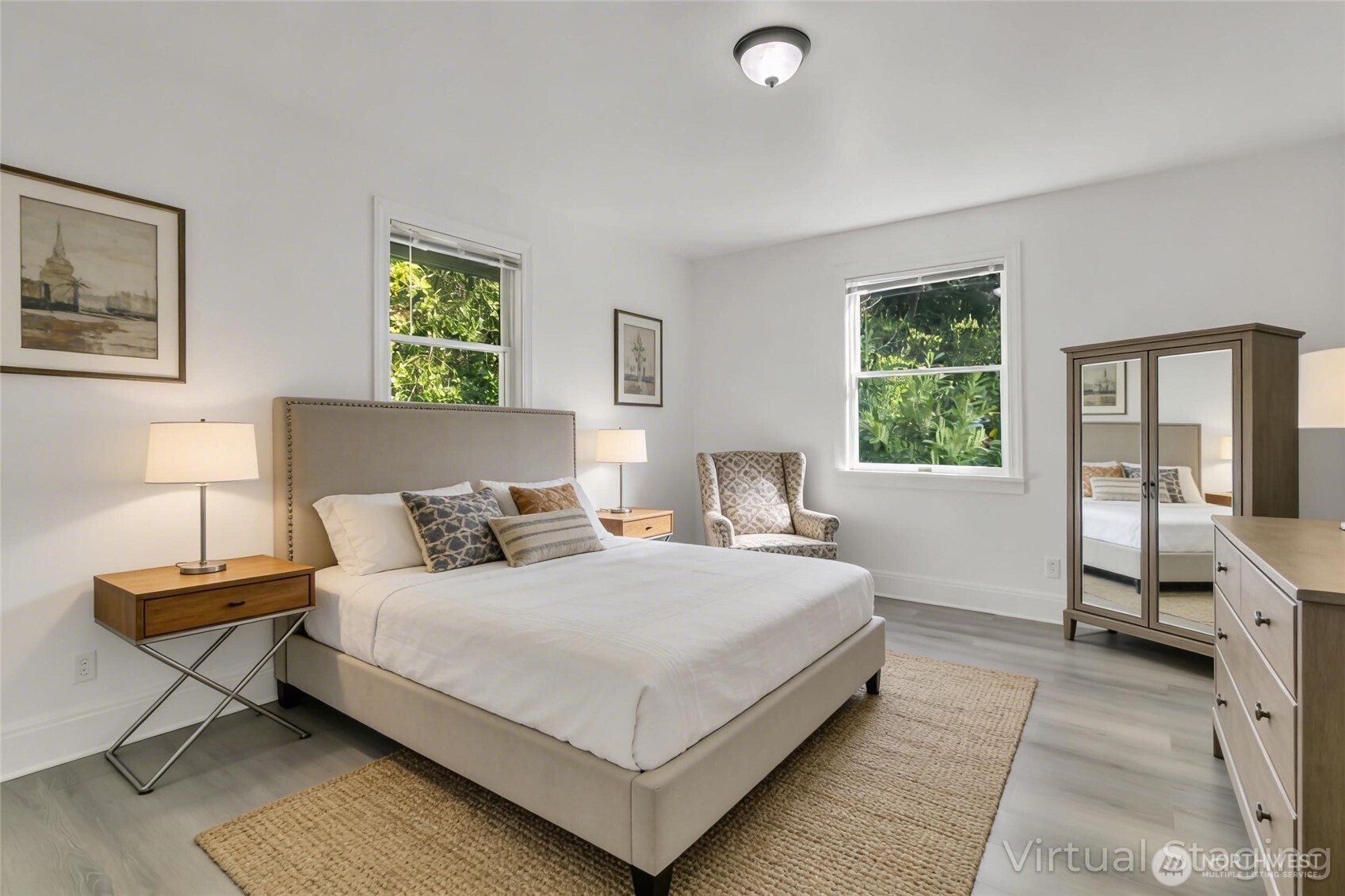 1622 Southwest 140th Street Burien, WA 98166 - Photo 21 of 38 a bedroom with a bed and large windows