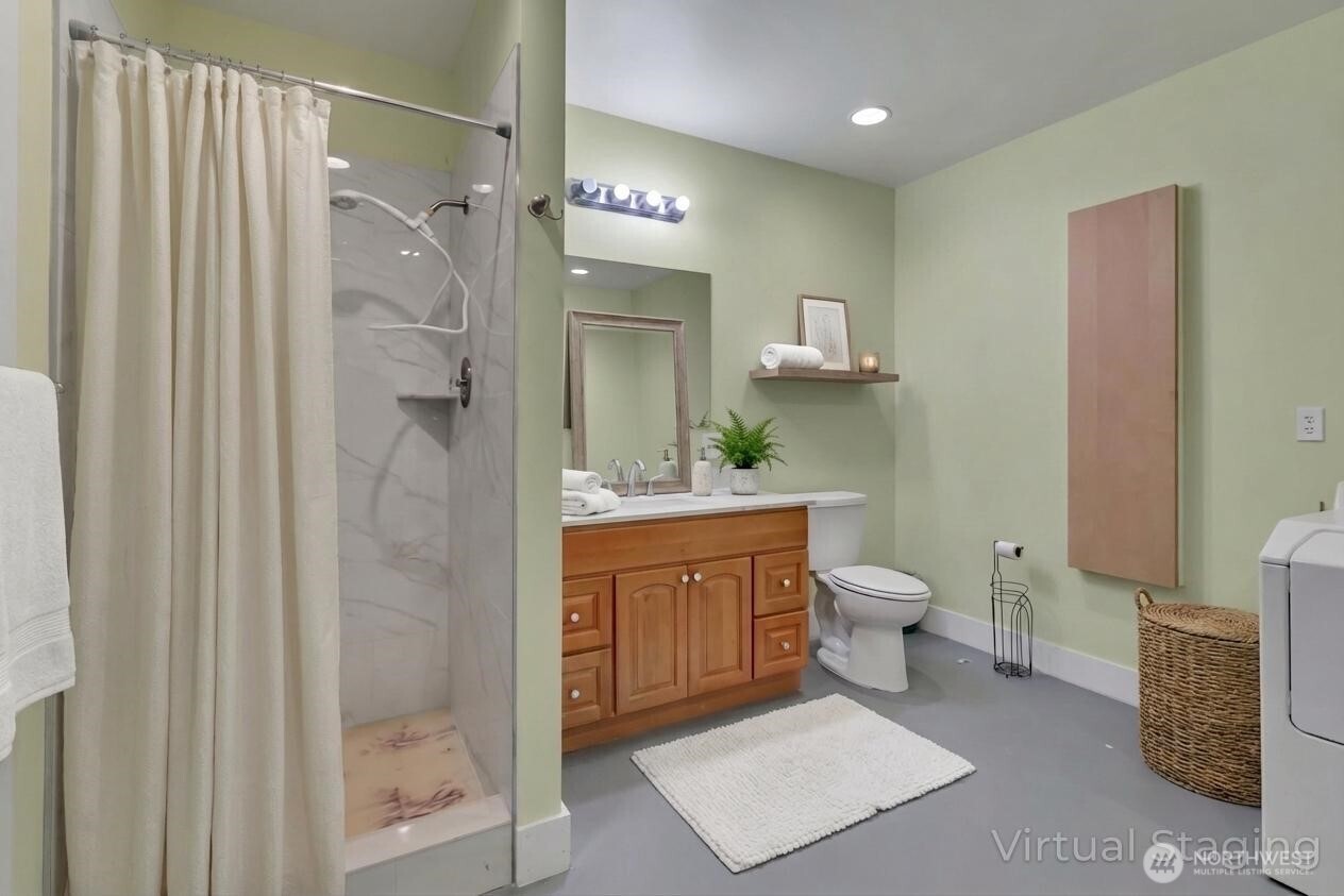 1622 Southwest 140th Street Burien, WA 98166 - Photo 23 of 38 a bathroom with a toilet a sink and a mirror