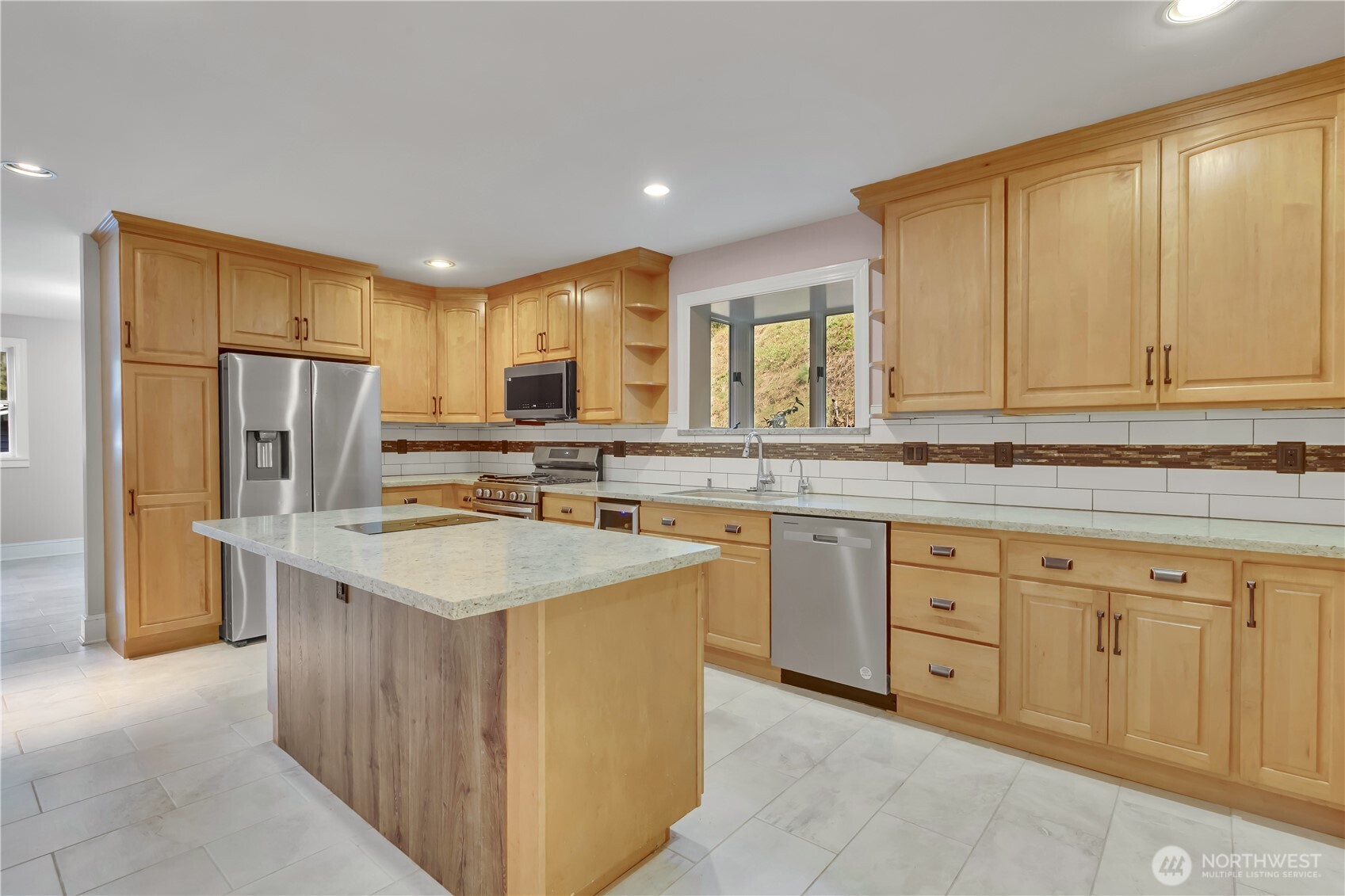 1622 Southwest 140th Street Burien, WA 98166 - Photo 32 of 38 a kitchen with stainless steel appliances granite countertop a sink stove refrigerator and cabinets
