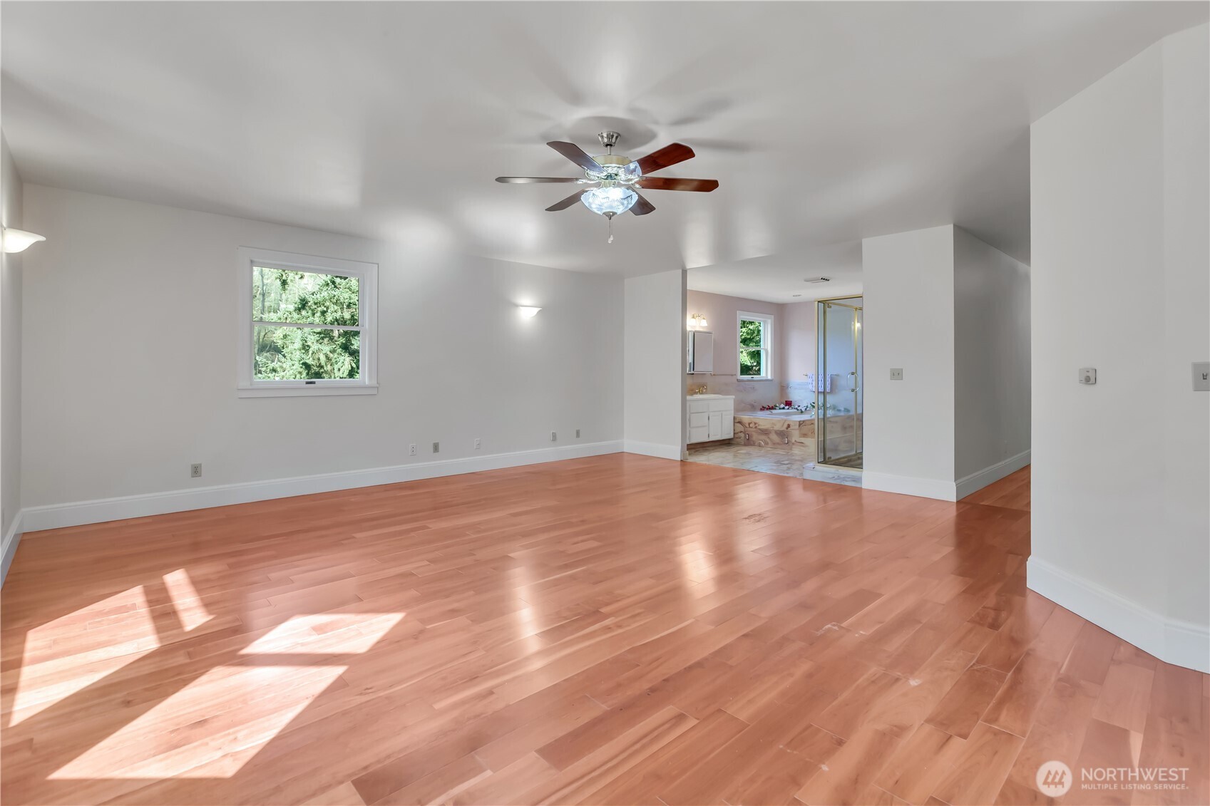 1622 Southwest 140th Street Burien, WA 98166 - Photo 37 of 38 a view of empty room with wooden floor and fan