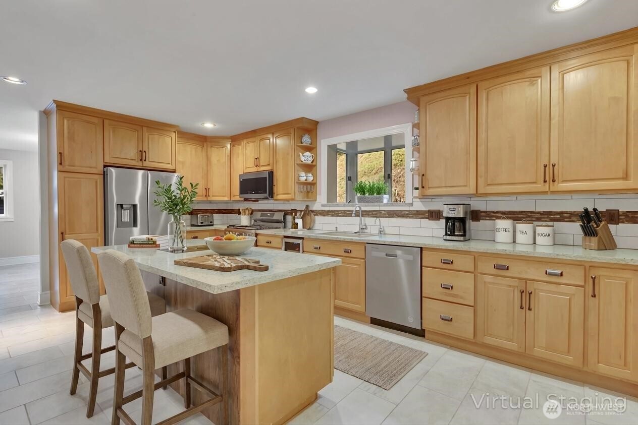 1622 Southwest 140th Street Burien, WA 98166 - Photo 5 of 38 a kitchen with appliances a sink a counter top space cabinets and a window