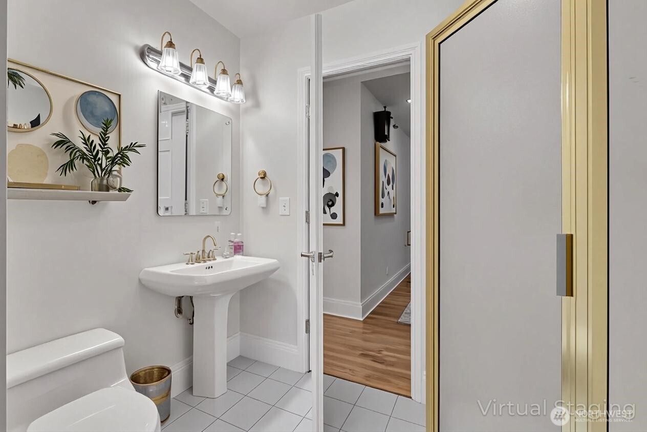 1622 Southwest 140th Street Burien, WA 98166 - Photo 10 of 38 a bathroom with a sink a toilet and shower